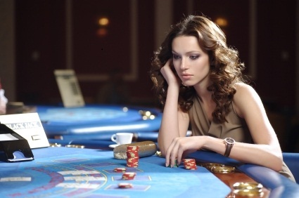 sexy girl playing poker at casino