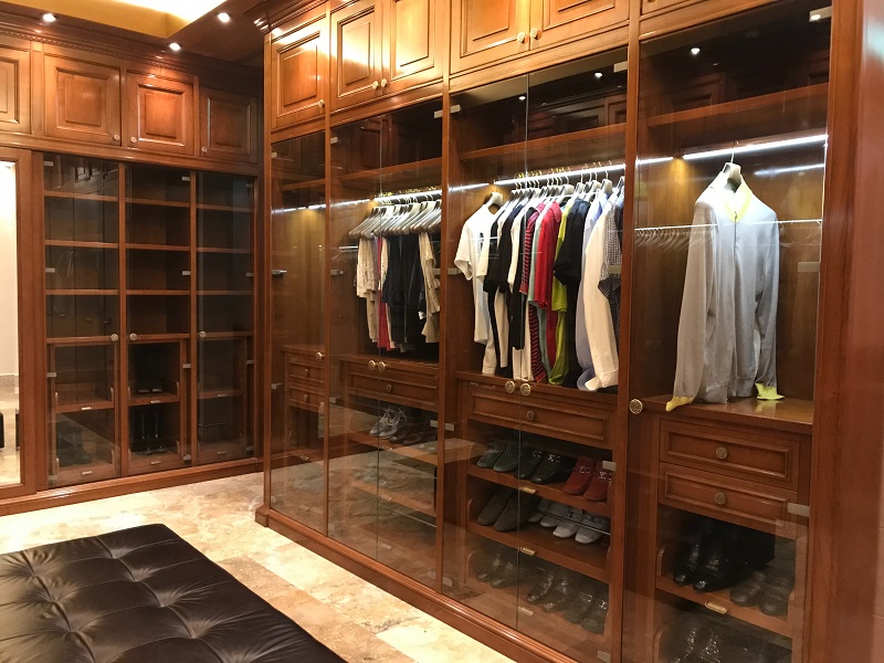 Luxurious brown wood elegant walk in closet